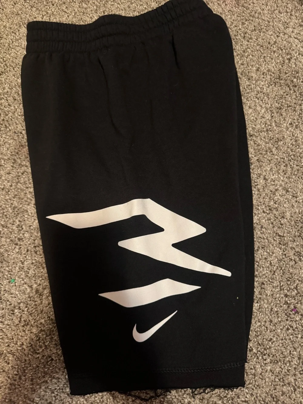 Nike Black Shorts with White Graphic Swoosh